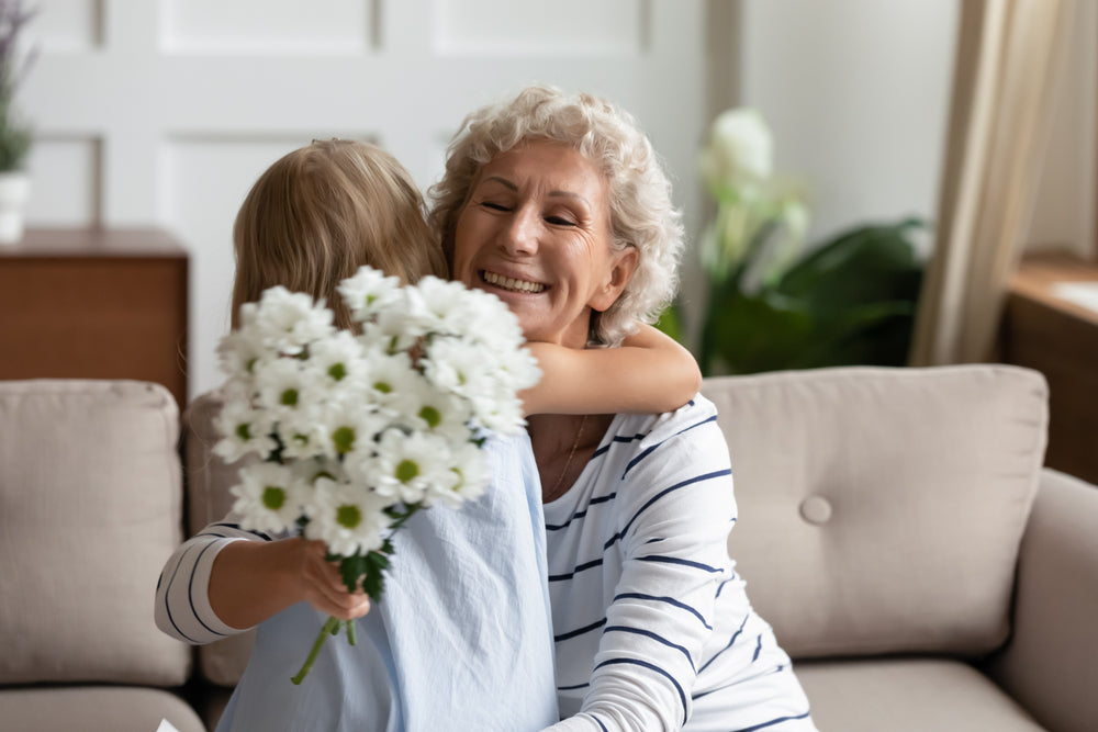 woman and child hugging with flowers